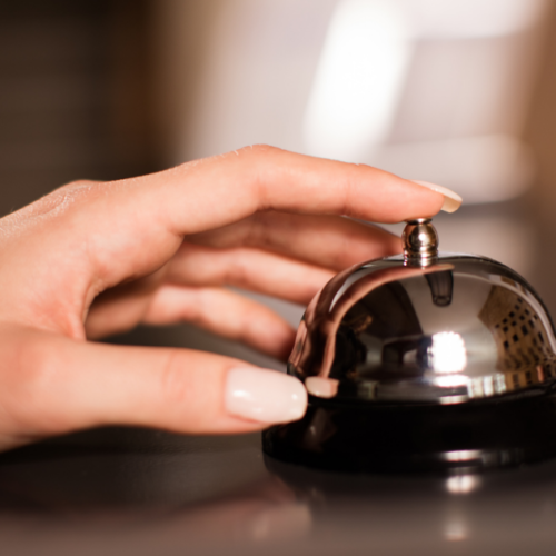 Customer ringing a reception bell